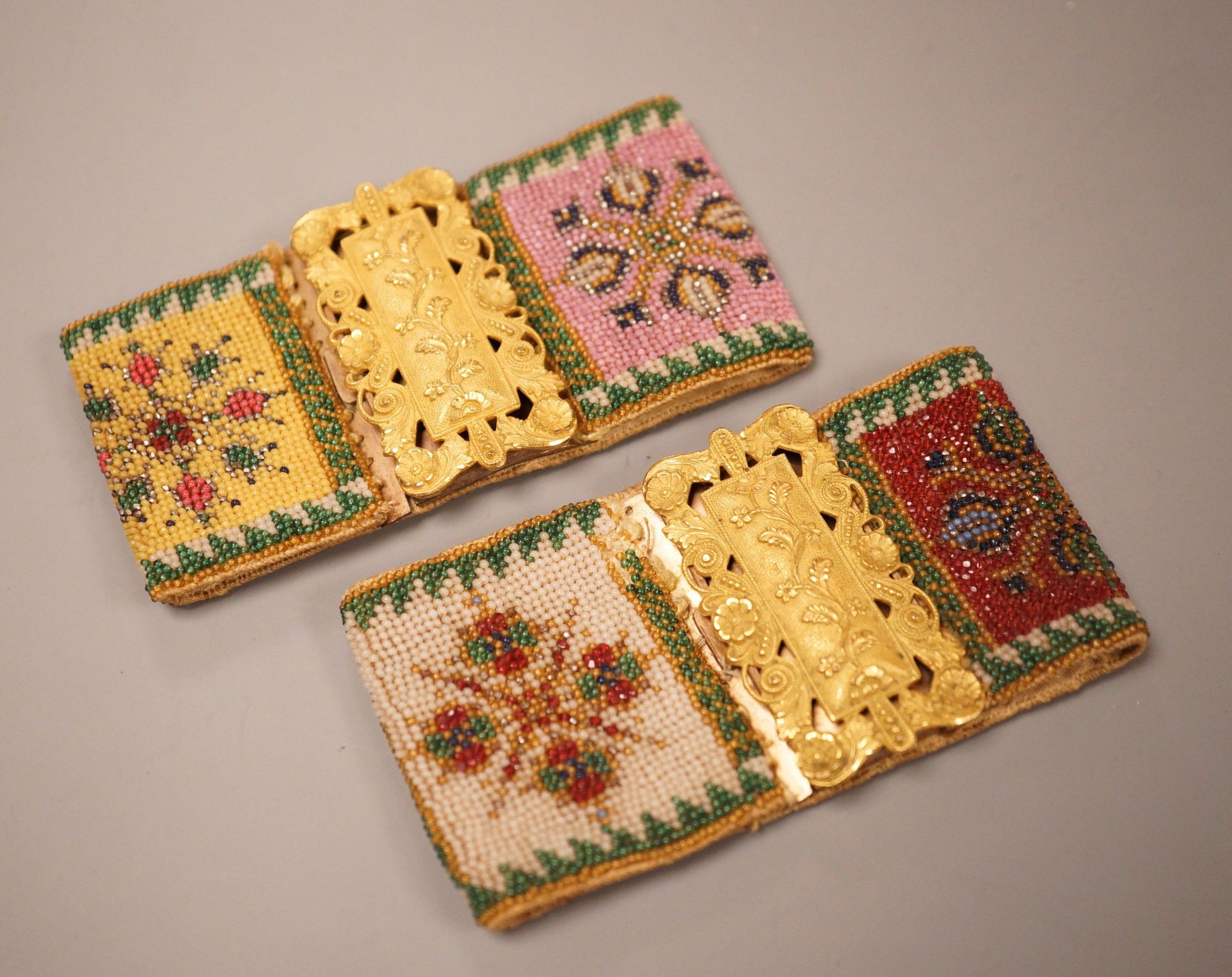 A pair of late Regency fine beadwork and ormolu bracelets